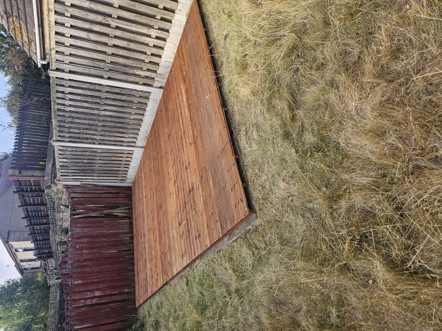 Existing concrete base prepared for the new custom-sized shed