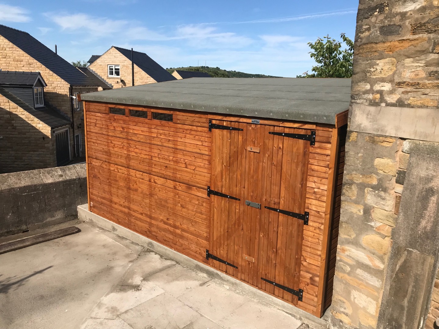 14 by 8 Pent Beast shed with five foot double doors opening onto the driveway