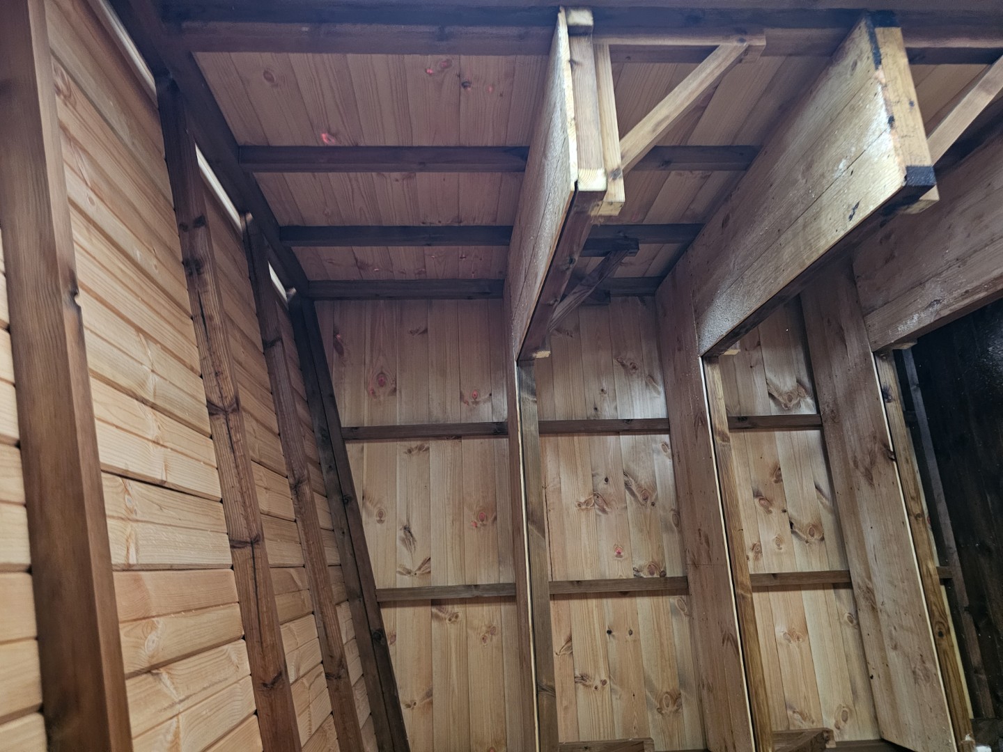 Multiple levels of timber shelving creating organised toy storage