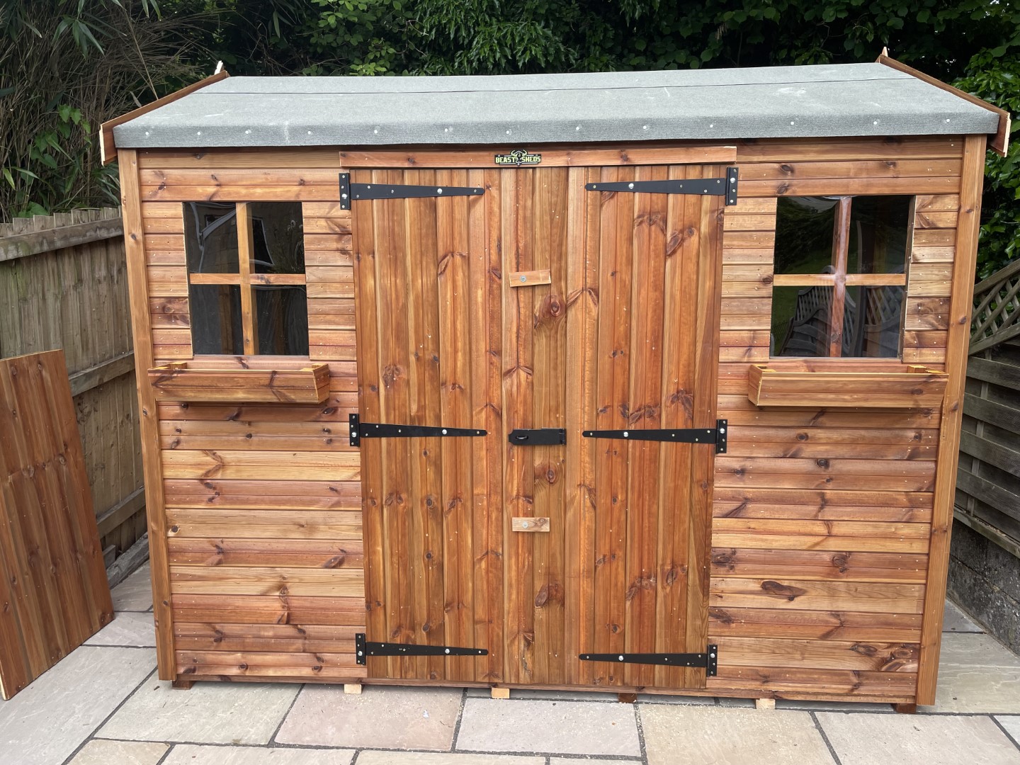 Front of the 9 by 6 Hipex-C shed with double doors, windows and window boxes
