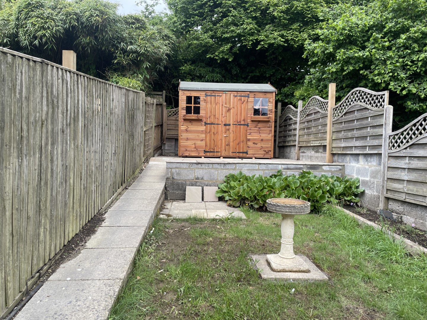 Hipex-C shed positioned prominently at the top of the Wolverhampton garden