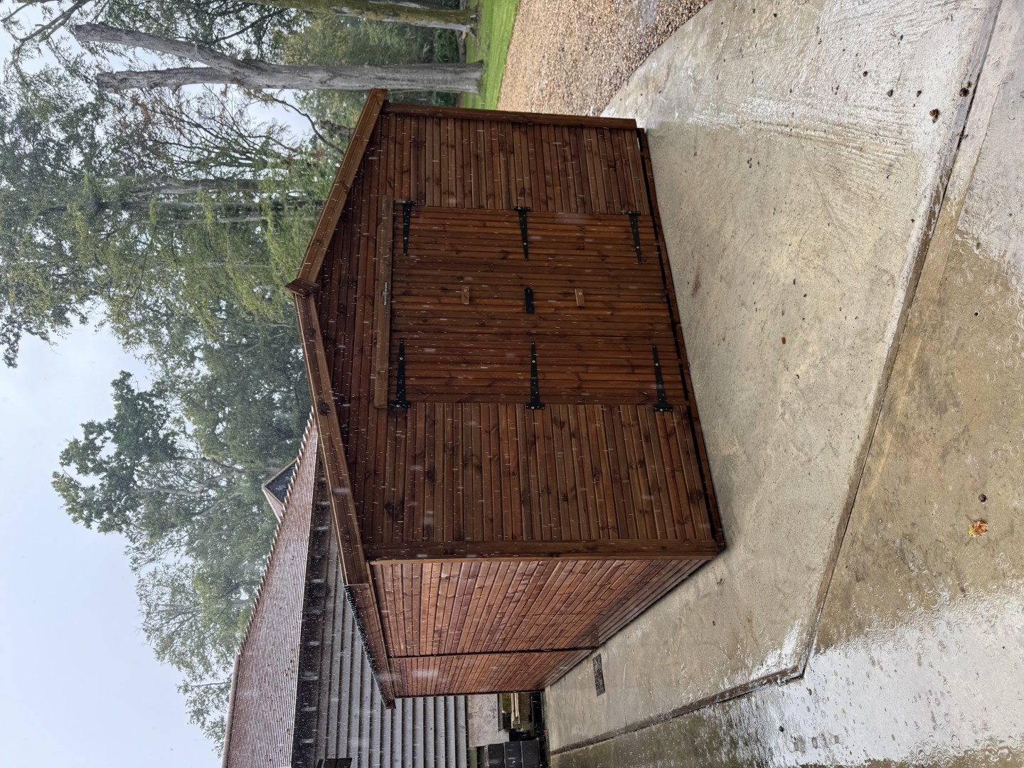 Worcester Beast shed installation taking place in heavy rain