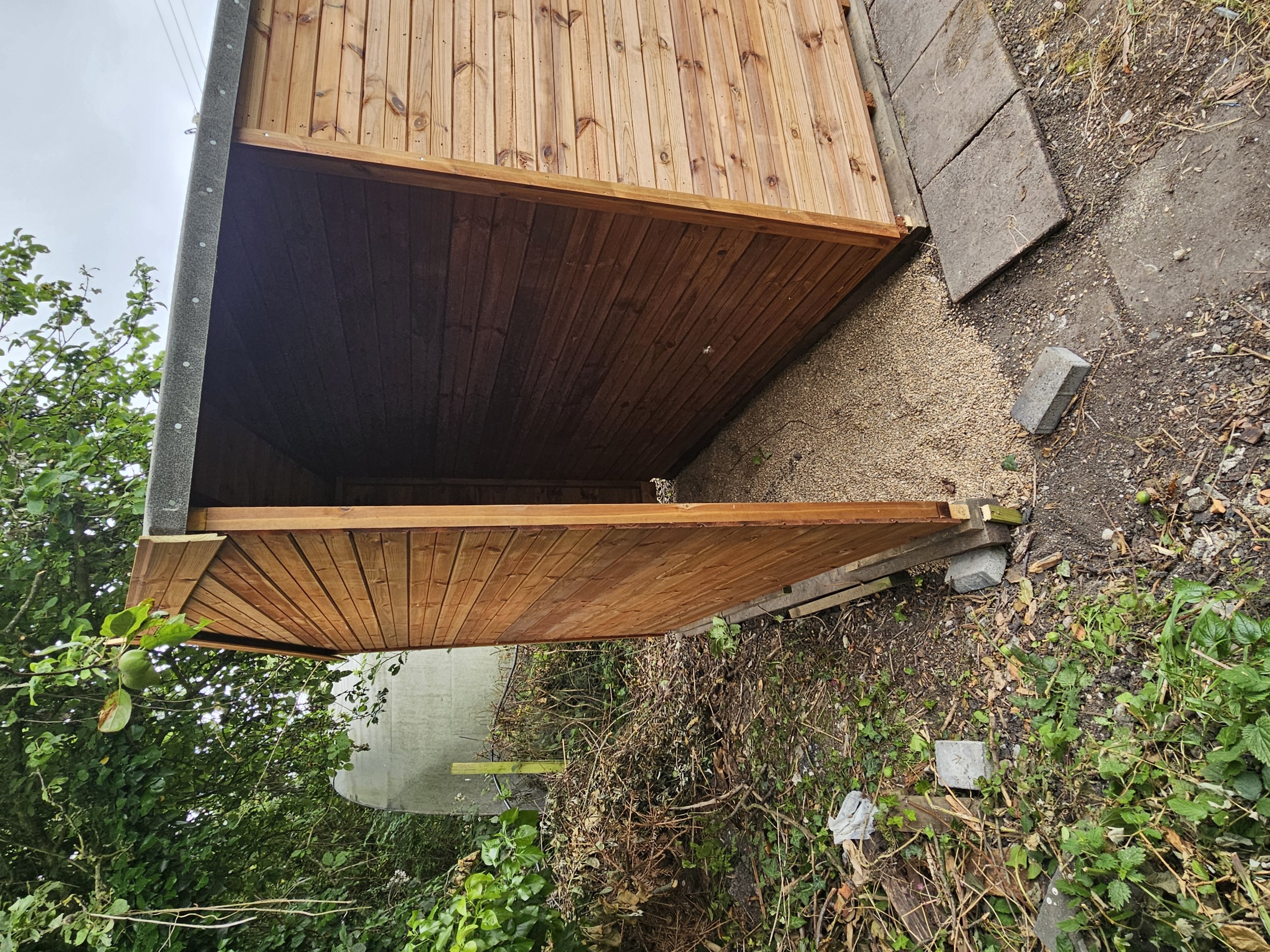 Shed extension with back and side walls covered