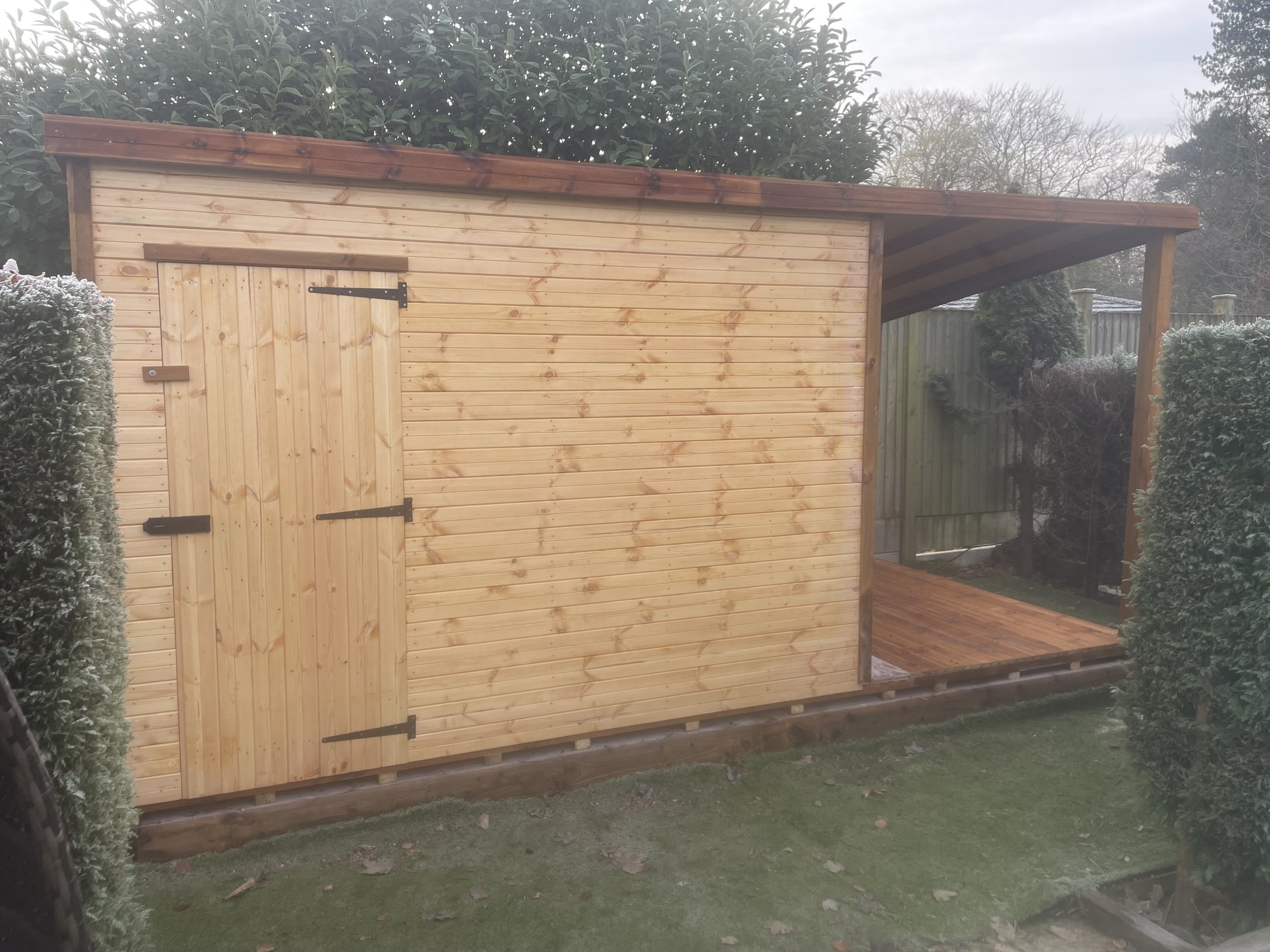 Open shed extension with timber floor