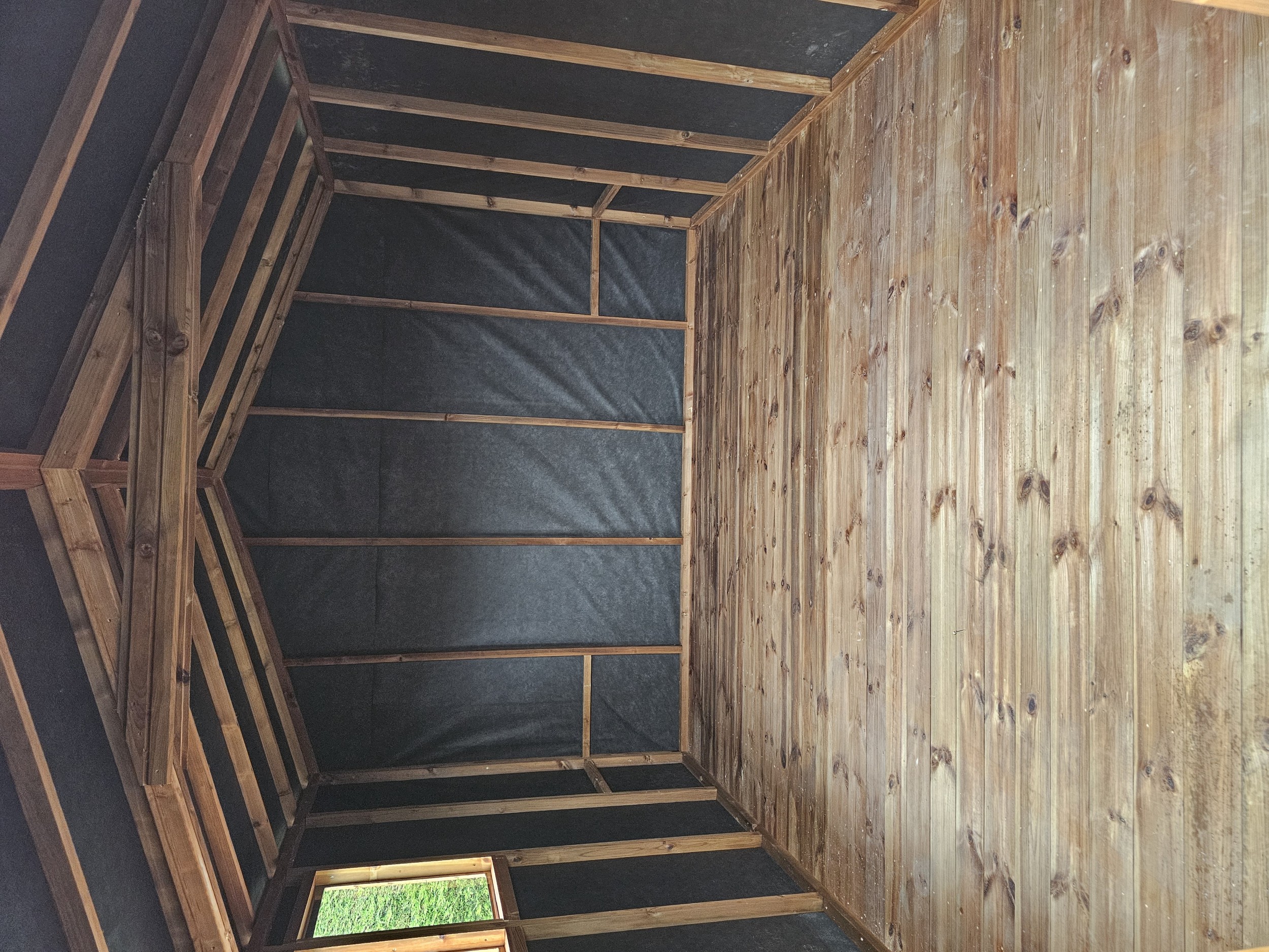 Breathable membrane installed between shed framework