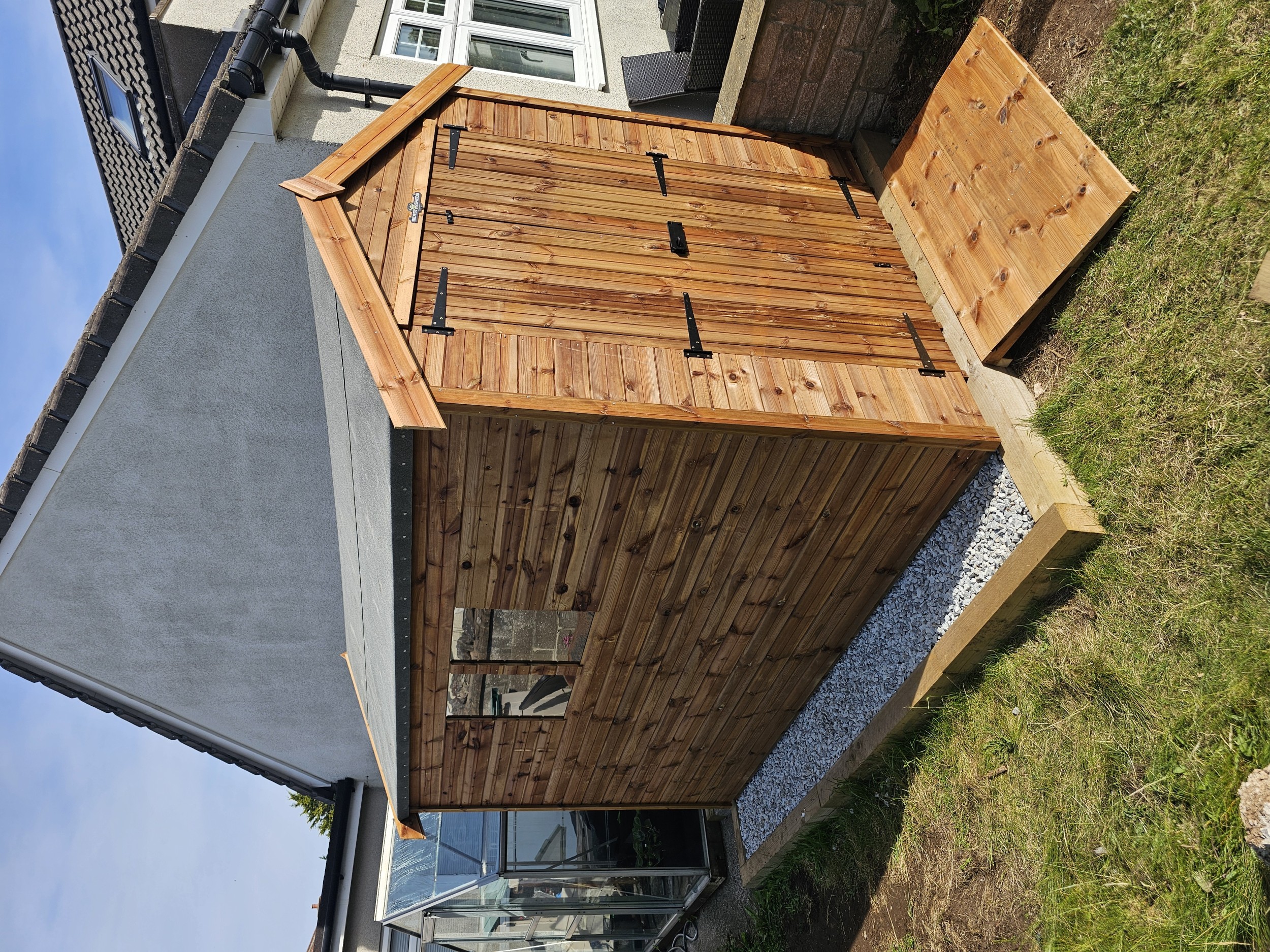 Treated timber access ramp at a shed entrance
