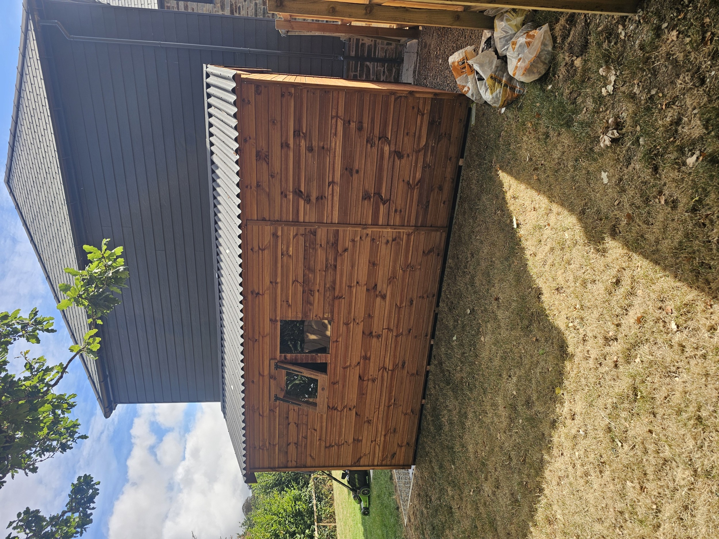 Shed with corrugated Onduline roof