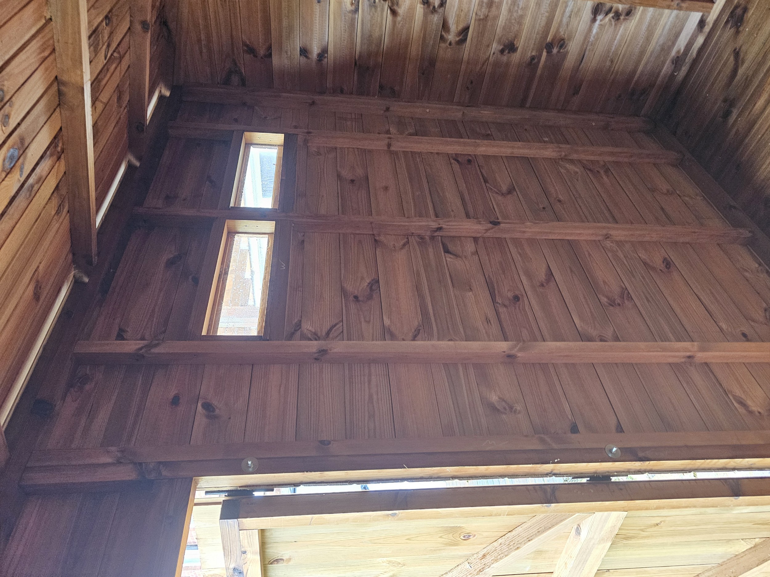 Internal framework around narrow security shed window